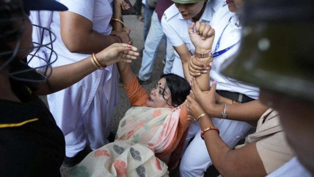 Police-detain-a-BJP-supporter-ruling-Bharatiya-Jan_1751125388174.jpg