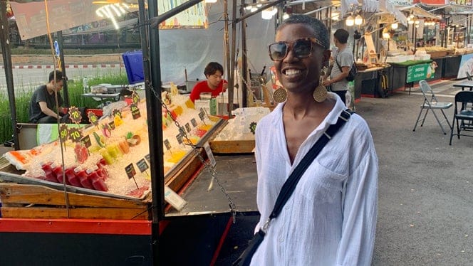 Tracye-McQuirter-at-a-farmers-market-overseas.jpg