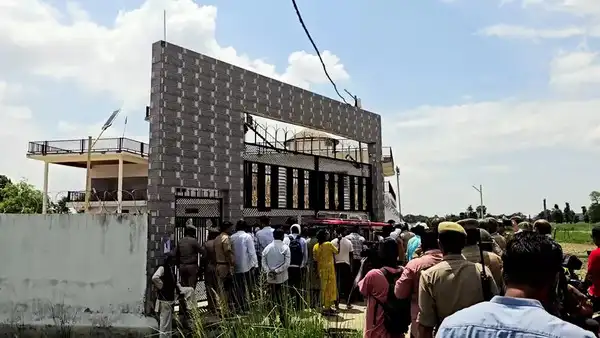Balrampur, Jul 08 (ANI): Police personnel present at the spot as Uttar Pradesh administration takes action on the properties belonging to Chhangur Baba, who is the alleged mastermind of a religious conversion gang, at Utraula in Balrampur on Tuesday. He was arrested by Uttar Pradesh ATS. (ANI Video Grab) Balrampur, Jul 08 (ANI): Police personnel present at the spot as Uttar Pradesh a...