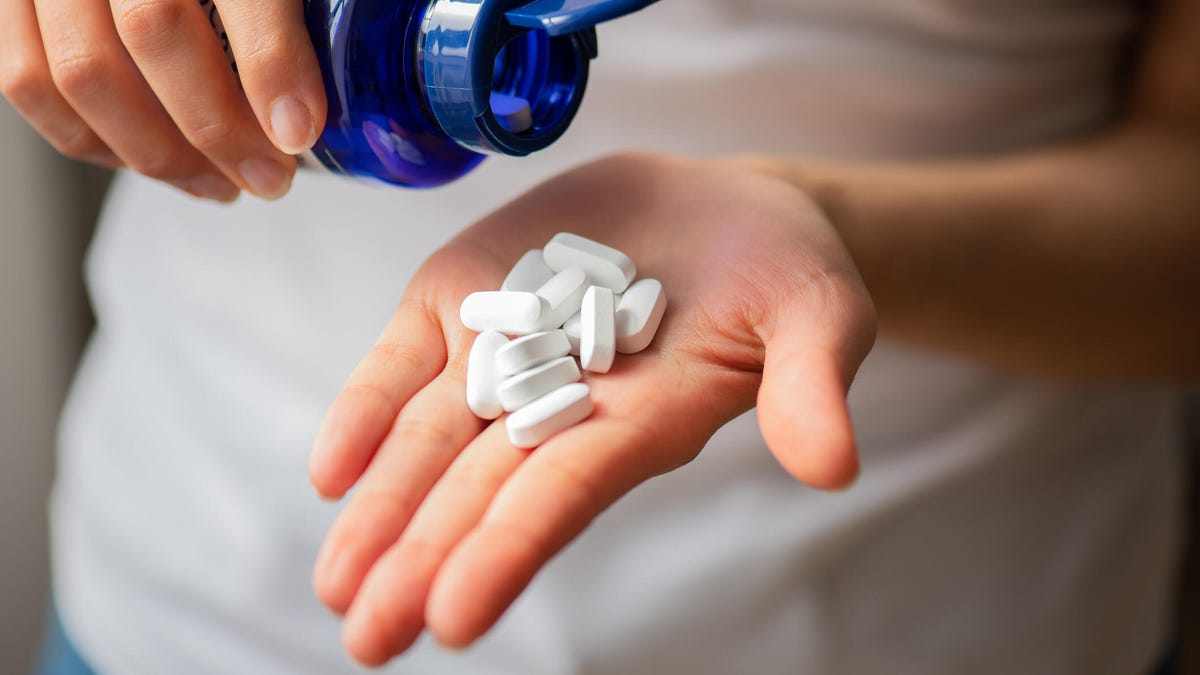 person-holding-white-pills.jpg